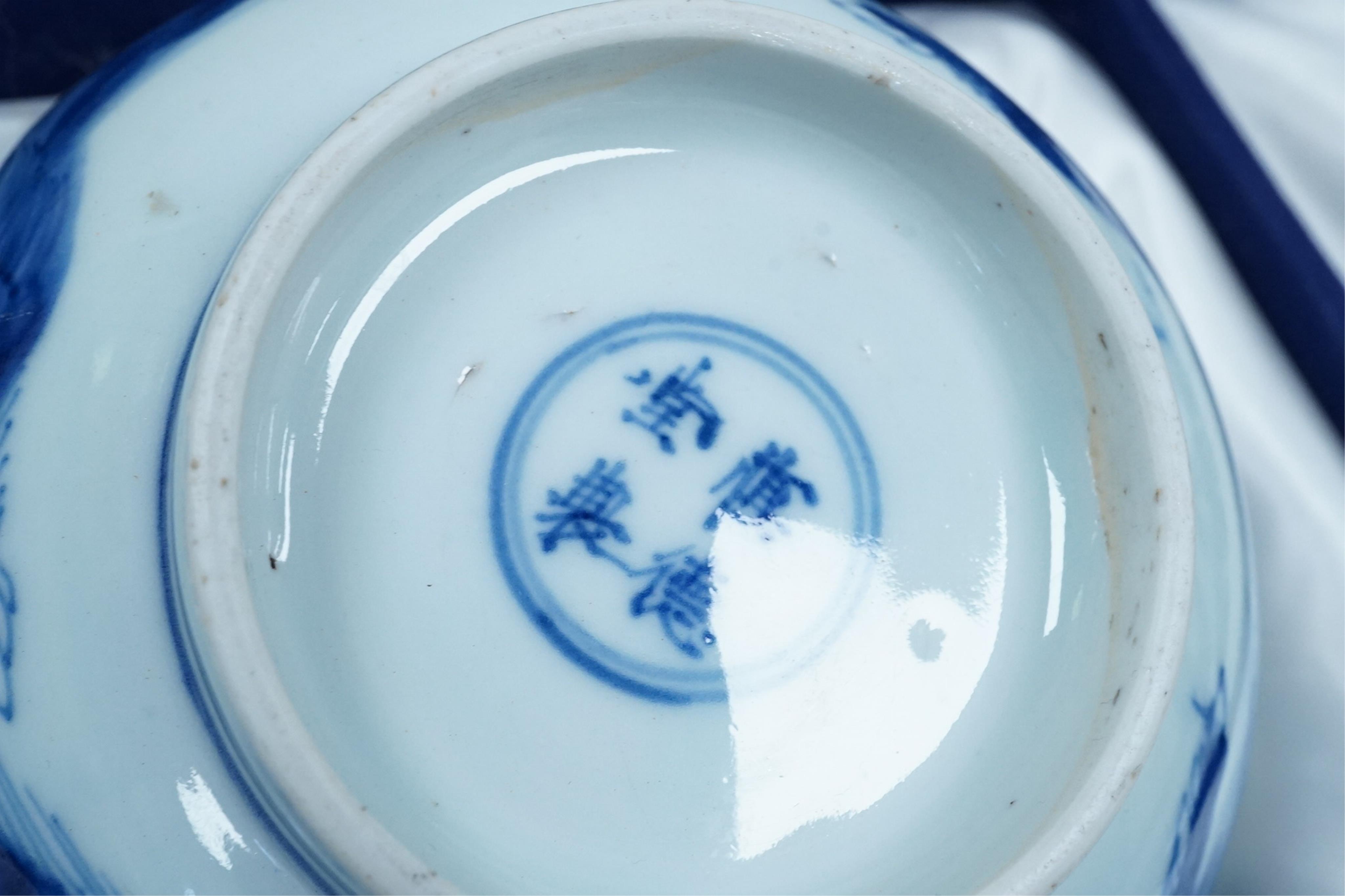 A pair of Chinese Transitional blue and white 'mythical beasts' bowls, early Kangxi period